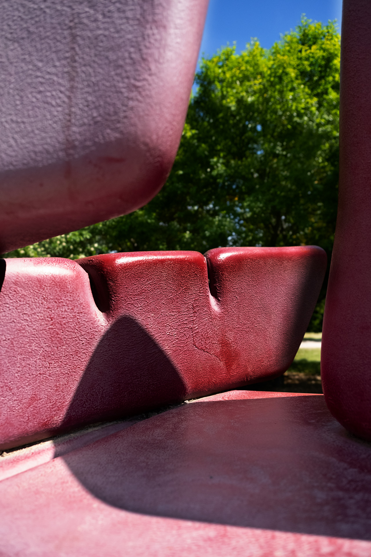 a colour detail photo of a red sculpture made of fiberglass 