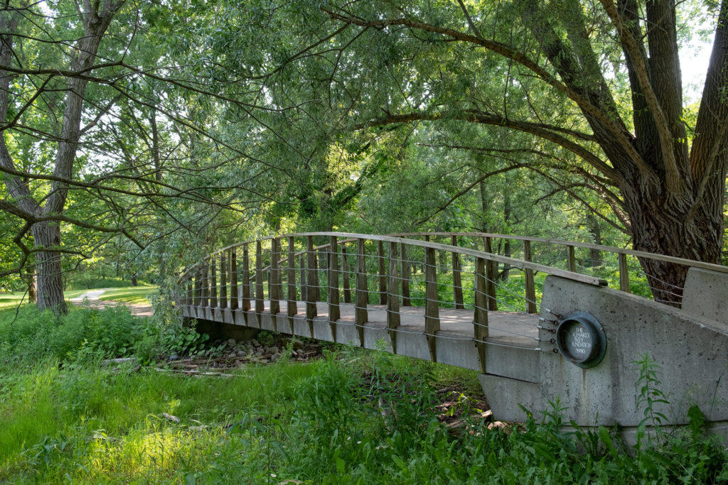 A colour photograph of a bridge over a streem.